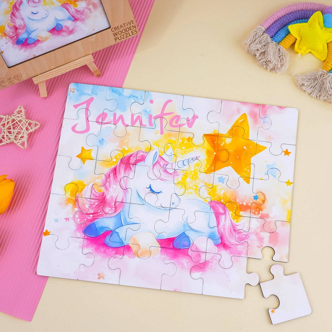 Custom wooden jigsaw puzzle featuring a sleeping unicorn and the name Jennifer, perfect for children's playtime.