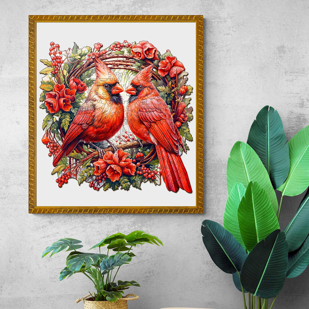 Framed illustration of two vibrant red cardinals surrounded by flowers and greenery, accentuating nature's beauty.