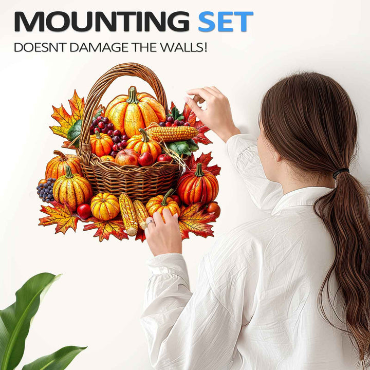 Woman applying an Autumn wooden jigsaw puzzle sticker on the wall with a basket of pumpkins and leaves.