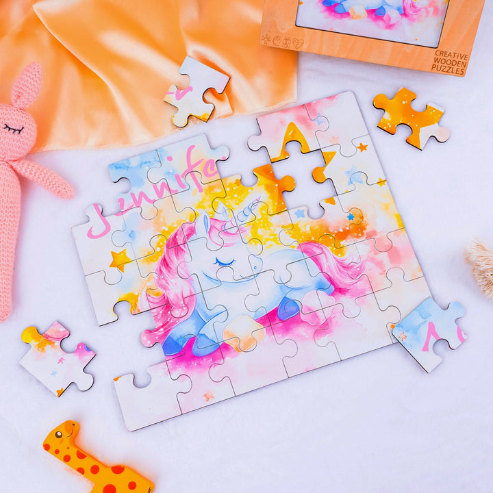 Custom wooden jigsaw puzzle featuring a sleeping unicorn and the name Jennifer, perfect for children's playtime.
