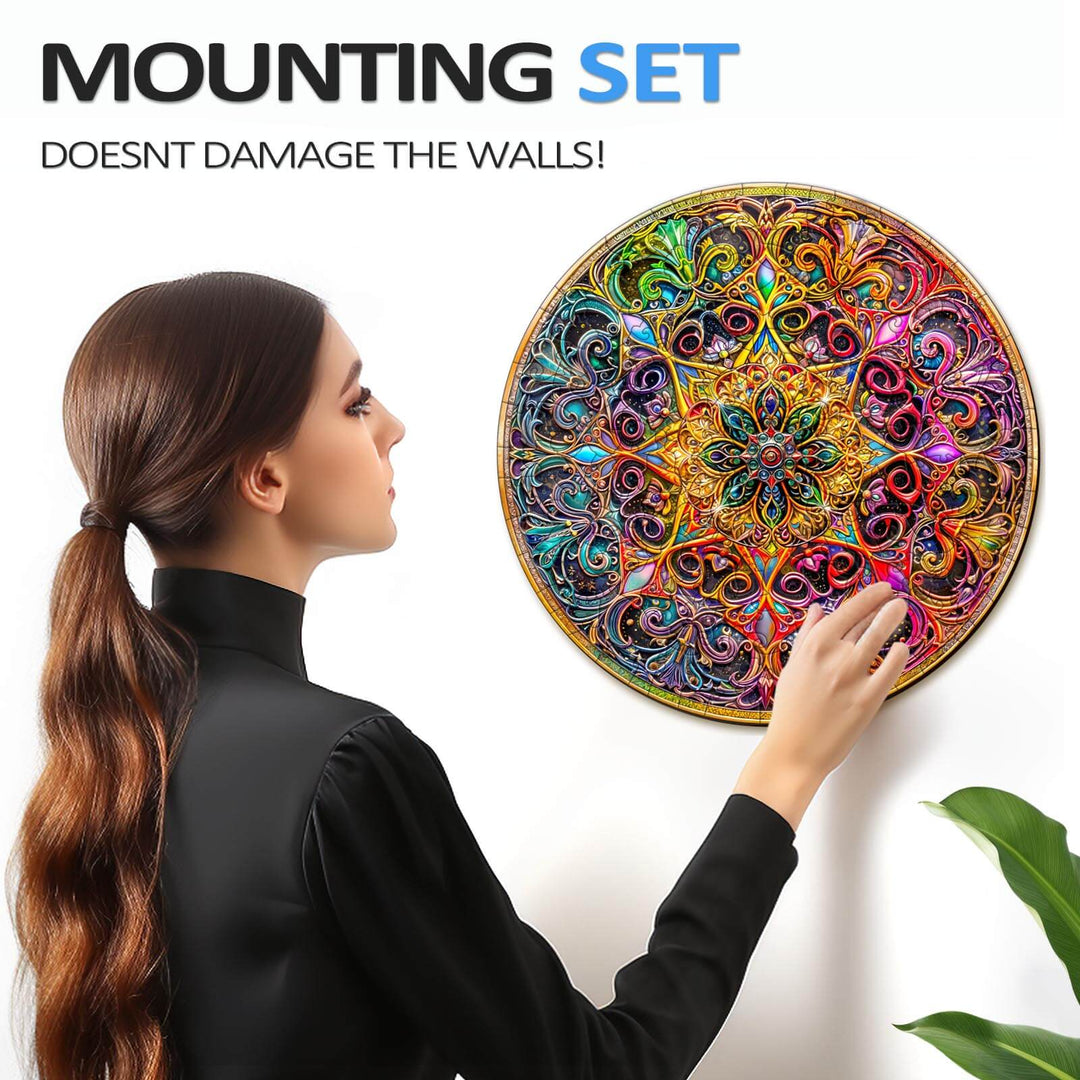 Woman attaching Mandala Dreamland puzzle to the wall using a damage-free mounting set.