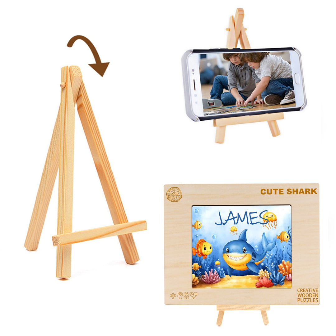 Wooden easel for displaying photos alongside a custom shark puzzle featuring the name James.