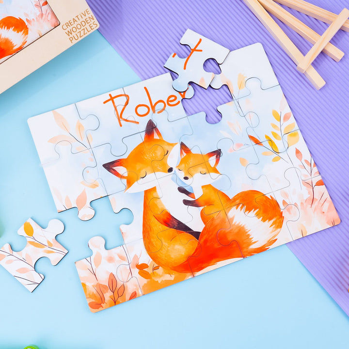Custom wooden jigsaw puzzle featuring foxes with child's name Robert, colorful autumn design, and vibrant pieces.