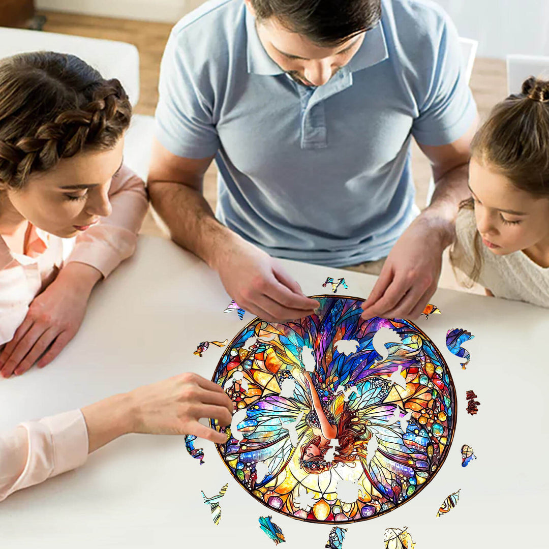 Family enjoying a Stained Glass Fairy wooden jigsaw puzzle on a table, promoting focus and creativity.