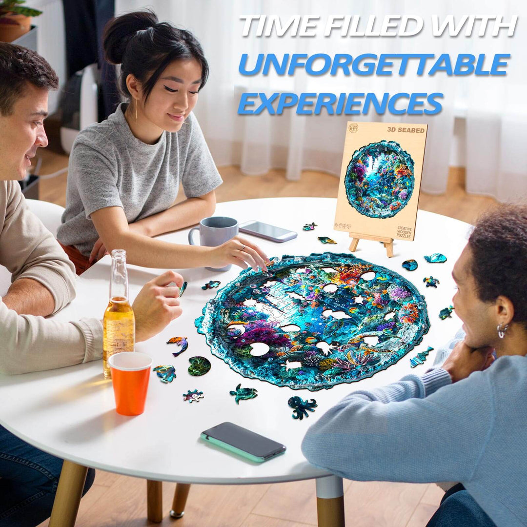 Group of friends enjoying the 3D Seabed Wooden Jigsaw Puzzle, surrounded by puzzle pieces and drinks.