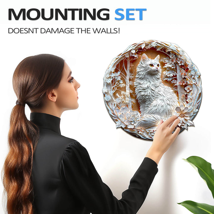 Person using a wall mounting set for a decorative cat puzzle without damaging the walls.