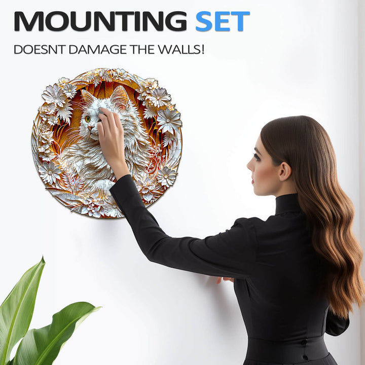 Woman installing a decorative cat puzzle on the wall with a mounting set that doesn't damage surfaces.