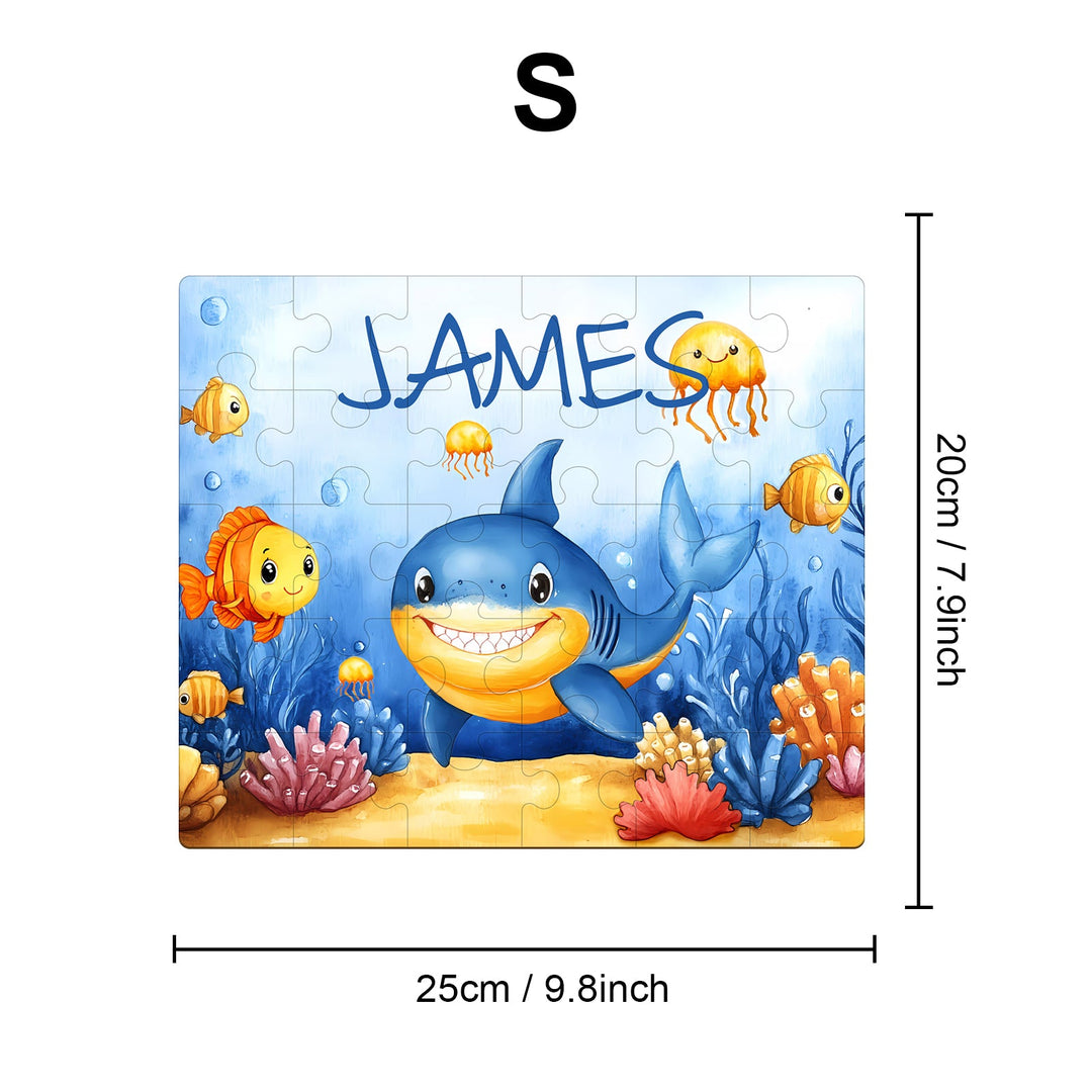 Personalized wooden jigsaw puzzle featuring a friendly shark and colorful fish, customized with the name James.