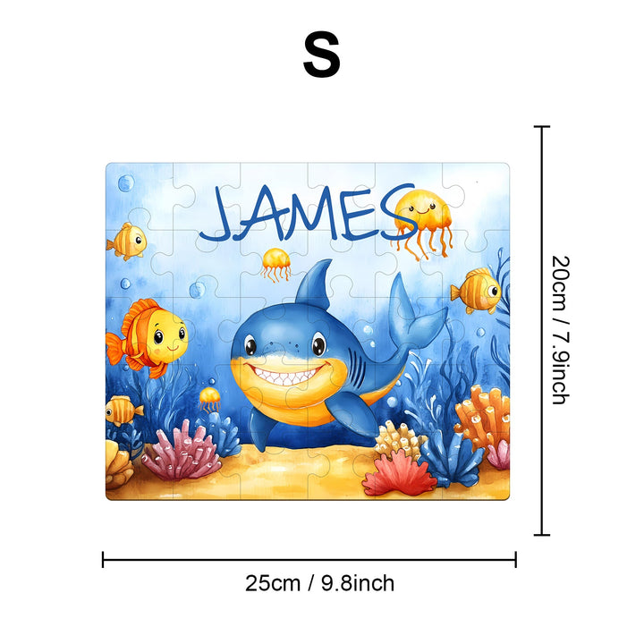 Personalized wooden jigsaw puzzle featuring a friendly shark and colorful fish, customized with the name James.